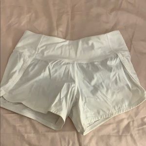 SIZE 2 WHITE LULULEMON SHORTS 4”